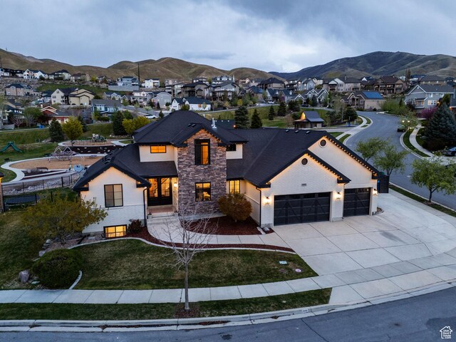 2696 W Red Robin Ct, Lehi, UT 84043 - view of front facade featuring a residential view, an attached garage, driveway, stone siding, and a mountain view