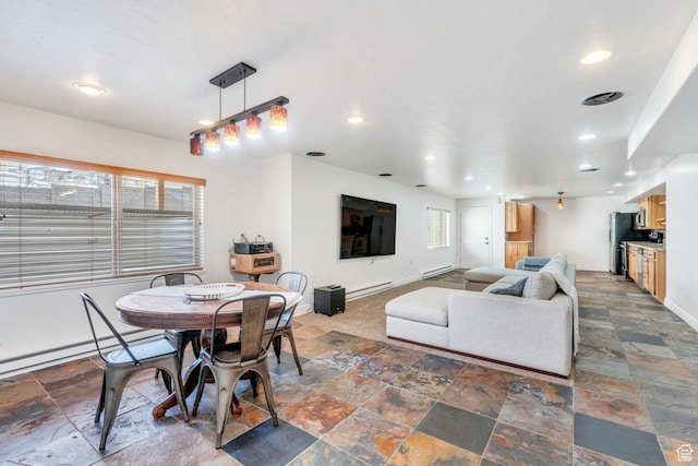 2696 W Red Robin Ct, Lehi, UT 84043 - dining space featuring stone tile floors, baseboards, and recessed lighting