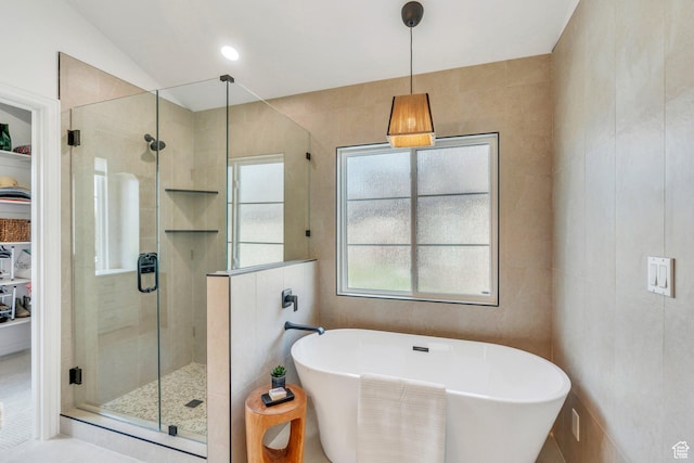 2696 W Red Robin Ct, Lehi, UT 84043 - bathroom with a freestanding bath, tile walls, and a stall shower