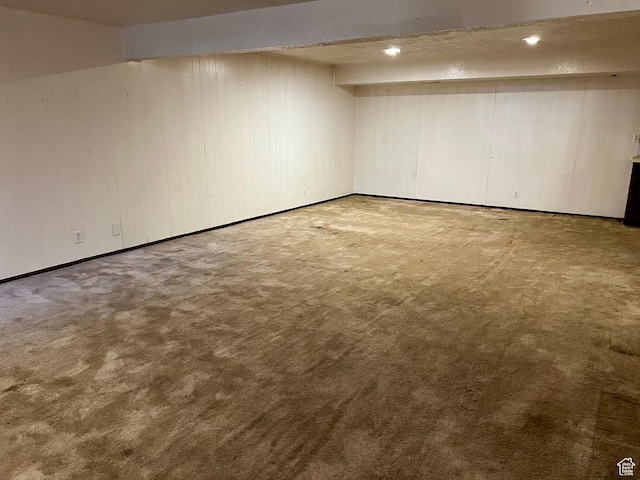 finished below grade area with recessed lighting, carpet floors, and baseboards