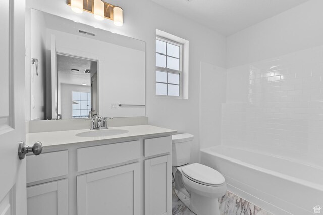 6717 N Tulle Mtn, Eagle Mountain, UT 84005 - bathroom featuring washtub / shower combination, visible vents, toilet, and vanity
