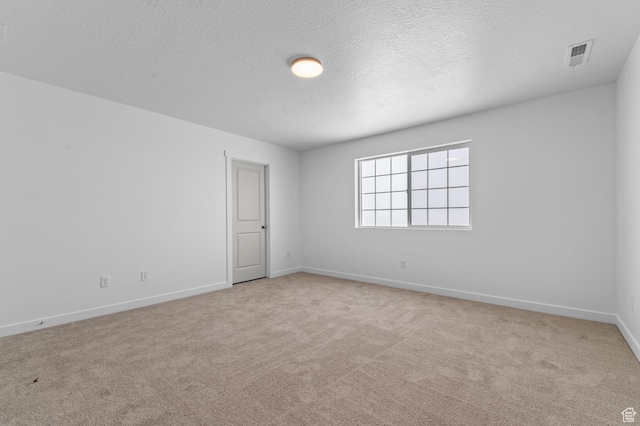 6717 N Tulle Mtn, Eagle Mountain, UT 84005 - empty room with baseboards, a textured ceiling, visible vents, and carpet