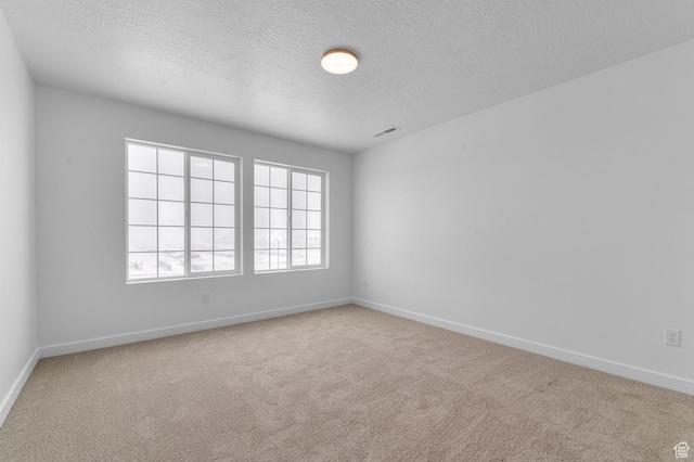 6717 N Tulle Mtn, Eagle Mountain, UT 84005 - carpeted spare room with baseboards, a textured ceiling, and visible vents