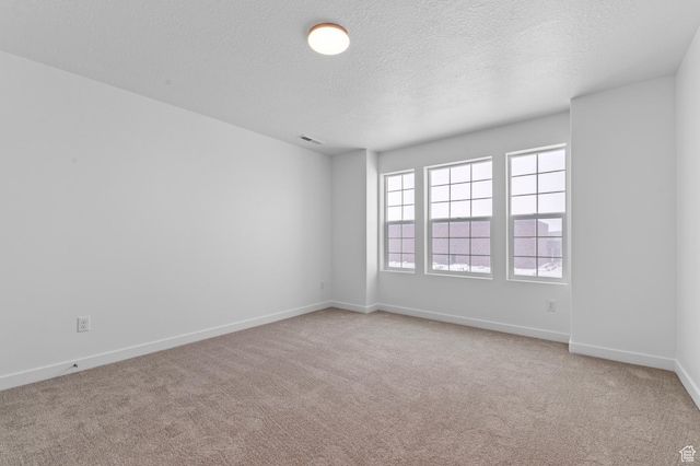 6717 N Tulle Mtn, Eagle Mountain, UT 84005 - unfurnished room featuring carpet, baseboards, visible vents, and a textured ceiling