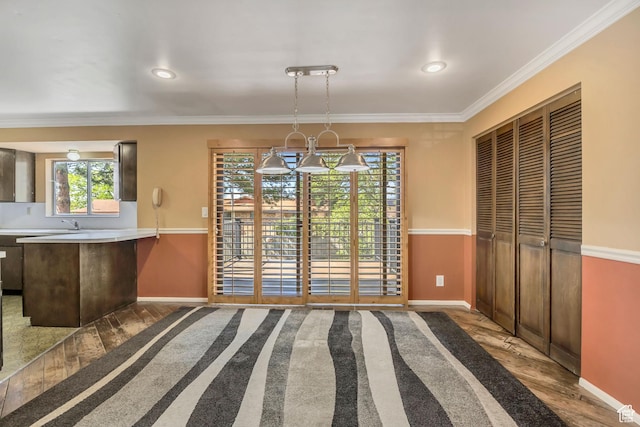 371 E 6770 S, Midvale, UT 84047 - unfurnished dining area featuring wood finished floors, baseboards, ornamental molding, and recessed lighting