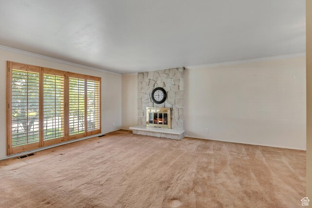 371 E 6770 S, Midvale, UT 84047 - unfurnished living room with crown molding, carpet flooring, and a stone fireplace
