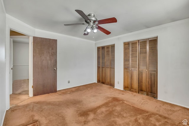 371 E 6770 S, Midvale, UT 84047 - unfurnished bedroom with two closets, carpet flooring, and ceiling fan