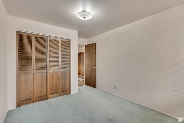 371 E 6770 S, Midvale, UT 84047 - unfurnished bedroom with carpet flooring, a closet, and baseboards