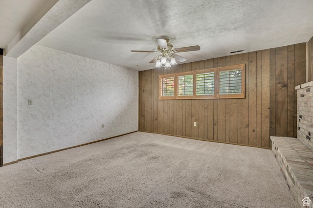 371 E 6770 S, Midvale, UT 84047 - empty room with a ceiling fan, carpet flooring, wood walls, a textured ceiling, and baseboards