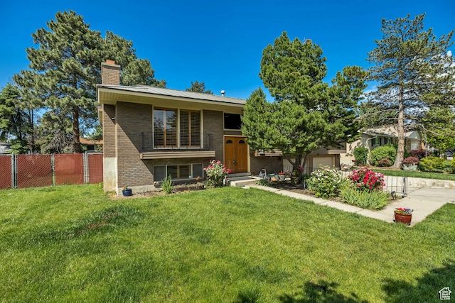 371 E 6770 S, Midvale, UT 84047 - bi-level home with brick siding and a chimney