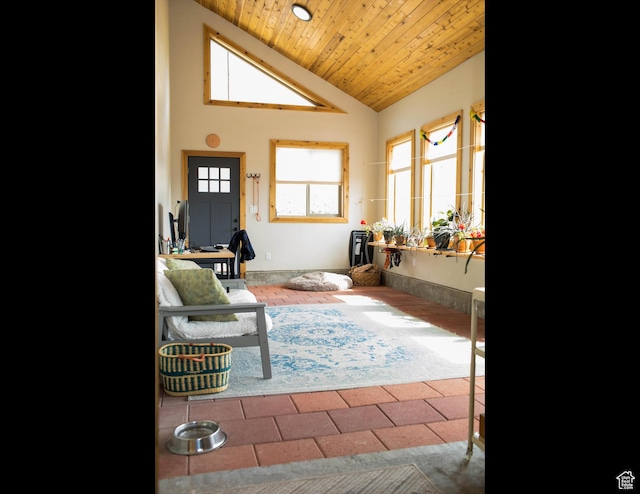 living room featuring wood ceiling and high vaulted ceiling