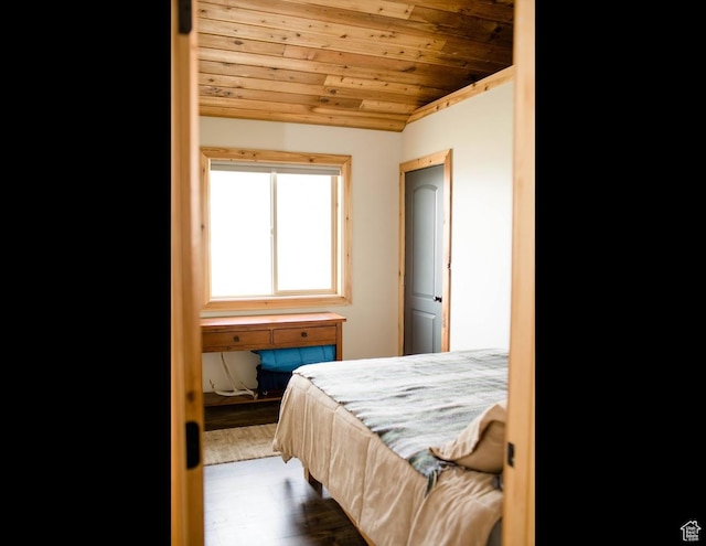bedroom with wood finished floors and wood ceiling