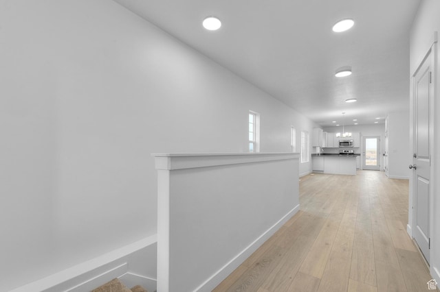6737 N Tulle Mtn, Eagle Mountain, UT 84005 - corridor with baseboards, light wood-style floors, and recessed lighting