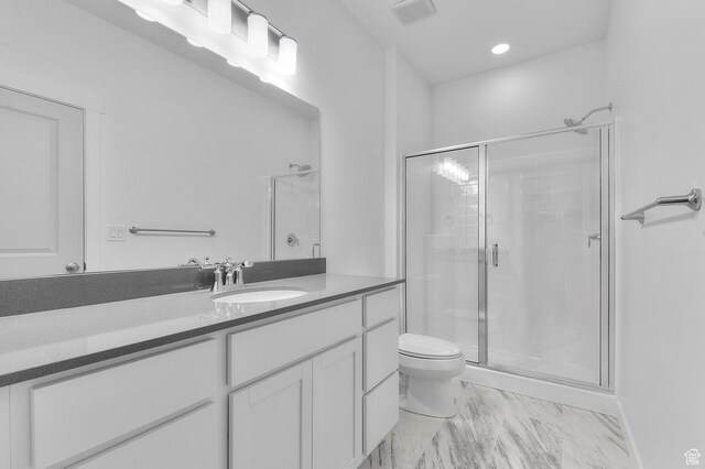 6737 N Tulle Mtn, Eagle Mountain, UT 84005 - bathroom with a shower stall, marble finish floor, toilet, and vanity