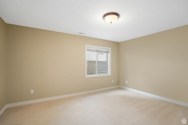 1321 E Farm Hill Dr, Salt Lake City, UT 84117 - spare room featuring baseboards, visible vents, and light carpet