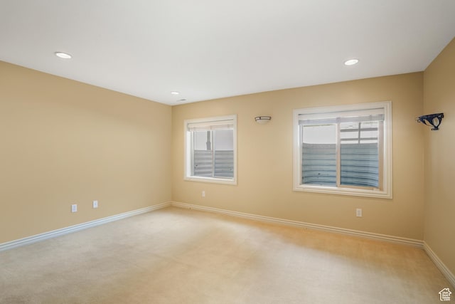 1321 E Farm Hill Dr, Salt Lake City, UT 84117 - spare room featuring recessed lighting, baseboards, a healthy amount of sunlight, and light colored carpet