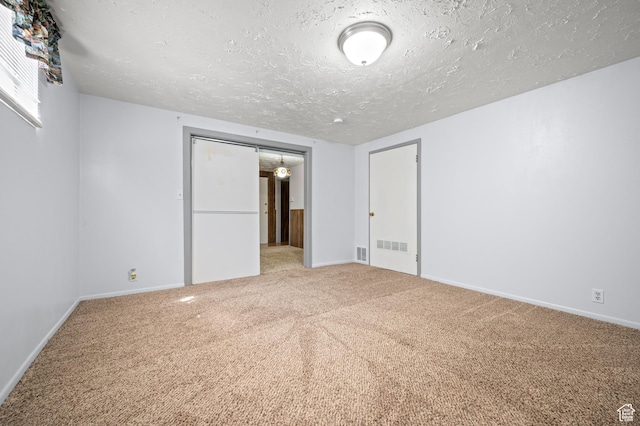 336 W 200 N, Bountiful, UT 84010 - unfurnished bedroom with a textured ceiling, visible vents, and carpet floors