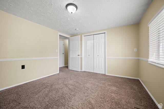 336 W 200 N, Bountiful, UT 84010 - unfurnished bedroom featuring a textured ceiling, carpet, a closet, and baseboards