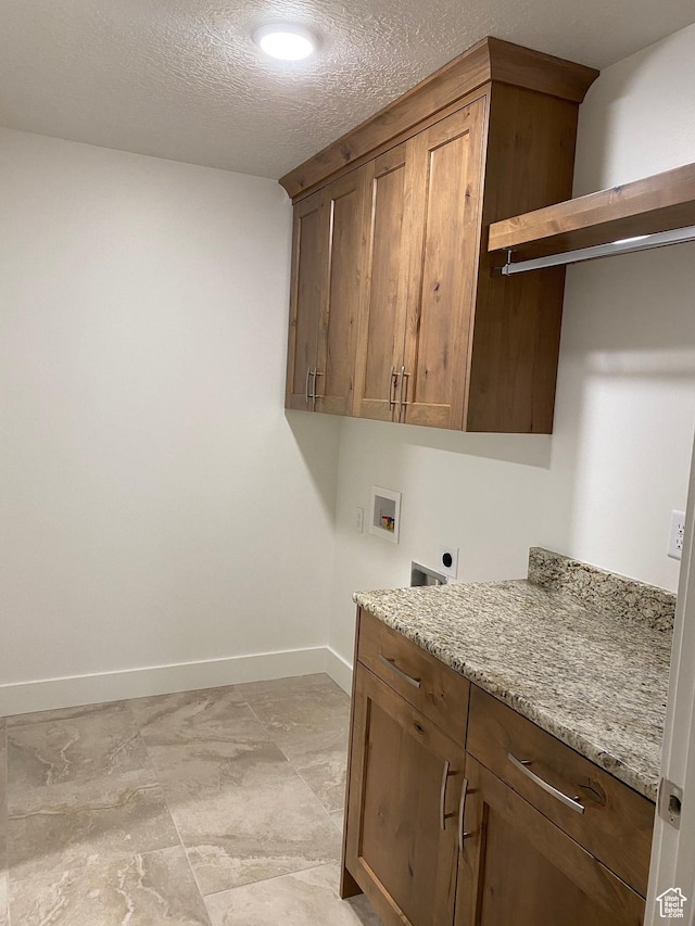 332 N 3250 W Unit 3, West Point, UT 84015 - laundry room with baseboards, electric dryer hookup, cabinet space, and washer hookup