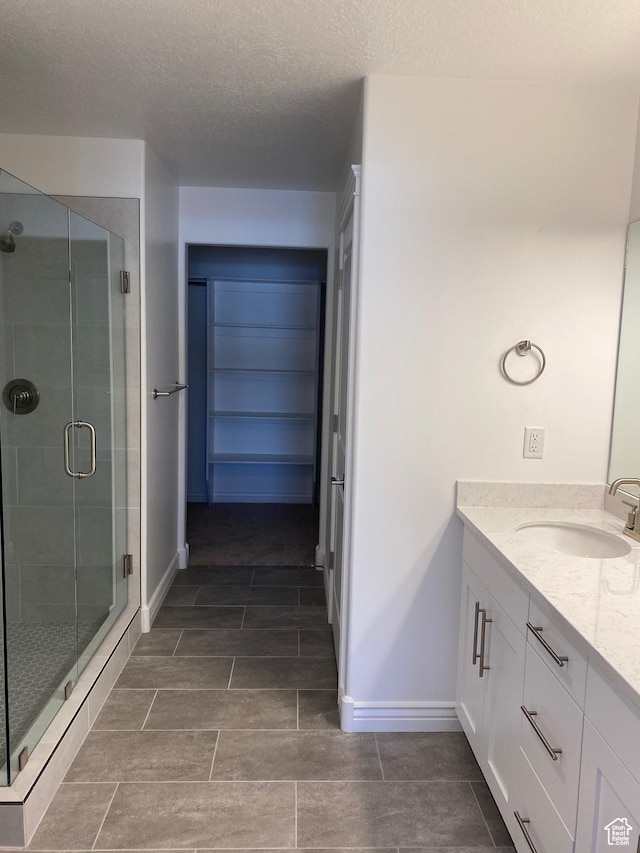 332 N 3250 W Unit 3, West Point, UT 84015 - full bath with baseboards, a textured ceiling, vanity, and a stall shower