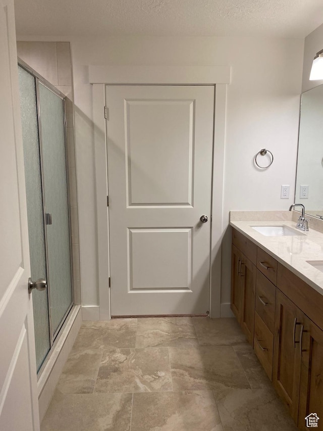 332 N 3250 W Unit 3, West Point, UT 84015 - full bathroom with a shower stall, stone finish floor, a sink, and double vanity