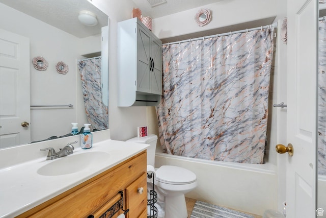 full bathroom featuring shower / bath combo with shower curtain, toilet, vanity, and tile patterned floors