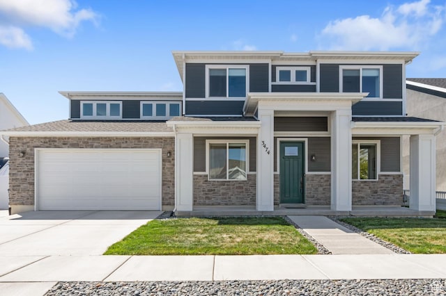prairie-style home featuring concrete driveway, an attached garage, a porch, and stone siding
