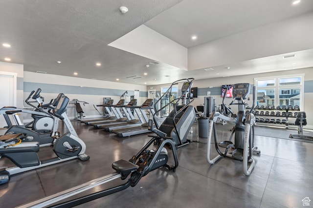 gym featuring recessed lighting, a healthy amount of sunlight, and visible vents