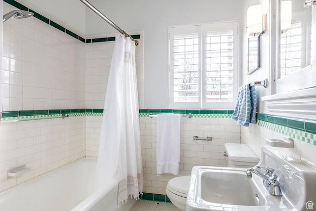 1283 E S Temple Unit 503, Salt Lake City, UT 84102 - full bath with a sink, toilet, tile walls, shower / bath combination with curtain, and wainscoting
