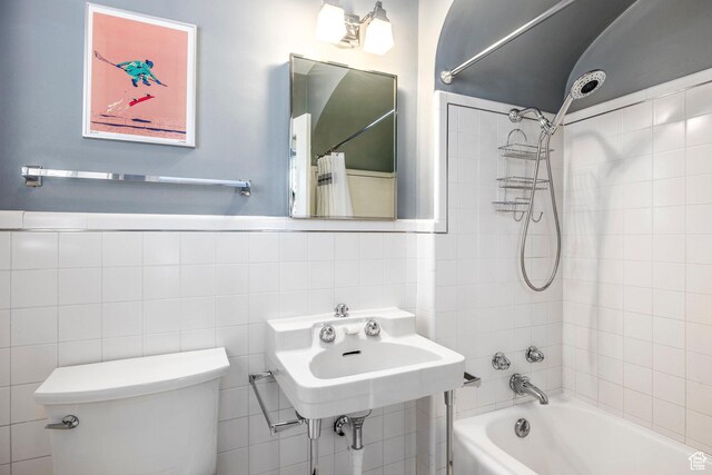 1283 E S Temple Unit 503, Salt Lake City, UT 84102 - full bath with shower / tub combo, tile walls, toilet, and a sink