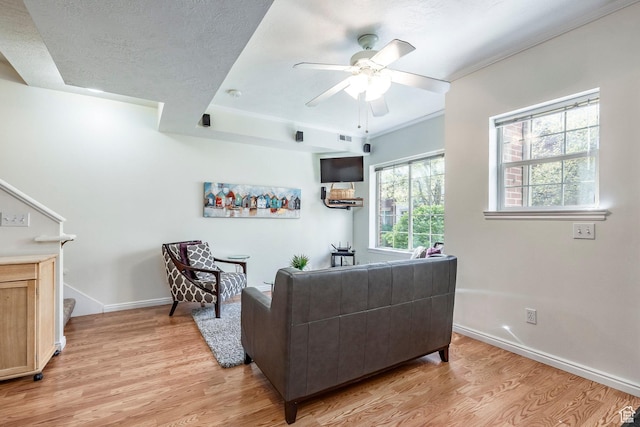 2503 S 160 E Unit 6D, Ogden, UT 84401 - living room featuring light wood-type flooring, a ceiling fan, and baseboards