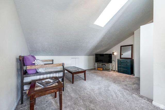 2503 S 160 E Unit 6D, Ogden, UT 84401 - living area featuring carpet floors, lofted ceiling with skylight, a textured ceiling, and baseboards