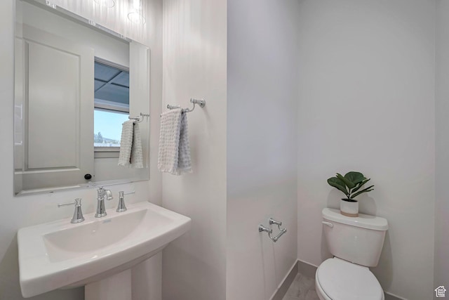 819 W Sara Dr, Saratoga Springs, UT 84045 - half bathroom with baseboards, a sink, and toilet