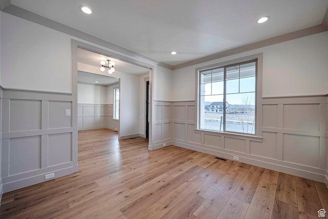 819 W Sara Dr, Saratoga Springs, UT 84045 - spare room with recessed lighting, visible vents, light wood-style floors, a decorative wall, and wainscoting