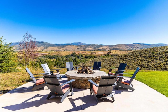 7785 E Stardust Ct Unit 322H, Heber City, UT 84032 - view of patio / terrace with a fire pit and a mountain view