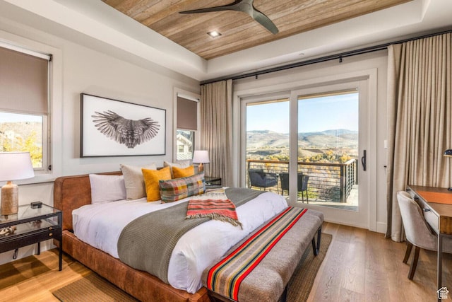 7785 E Stardust Ct Unit 322H, Heber City, UT 84032 - bedroom featuring a raised ceiling, wooden ceiling, a mountain view, light wood-style flooring, and access to outside