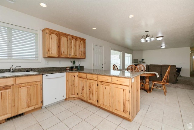 1176 E 900 S, Preston, ID 83263 - kitchen featuring white dishwasher, open floor plan, a chandelier, a peninsula, and light tile patterned floors