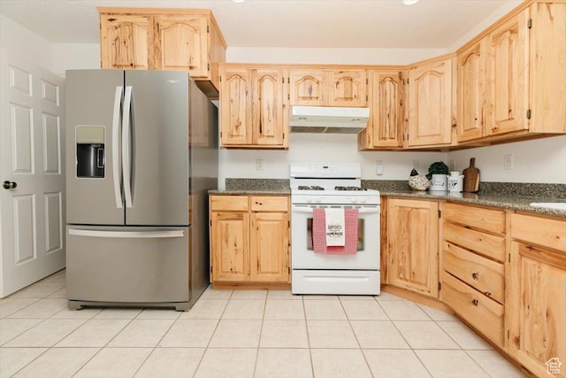 1176 E 900 S, Preston, ID 83263 - kitchen featuring stainless steel fridge, white range with gas stovetop, under cabinet range hood, light brown cabinetry, and light tile patterned floors