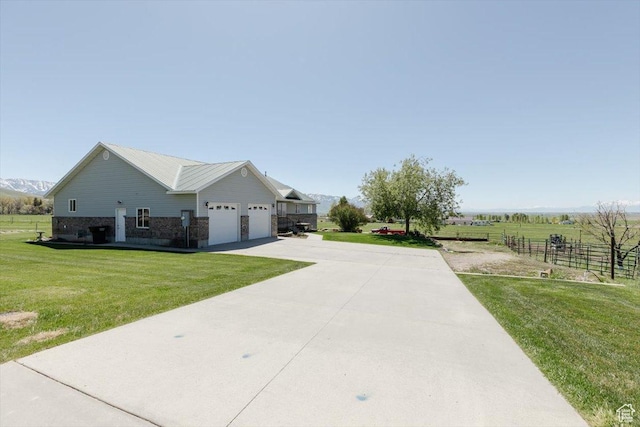 1176 E 900 S, Preston, ID 83263 - view of home's exterior with concrete driveway, a garage, and brick siding