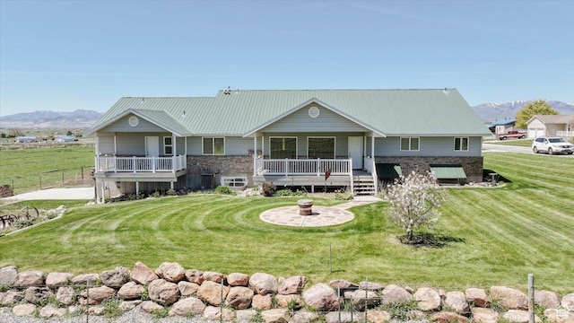1176 E 900 S, Preston, ID 83263 - view of front facade with a front lawn, a mountain view, and a metal roof