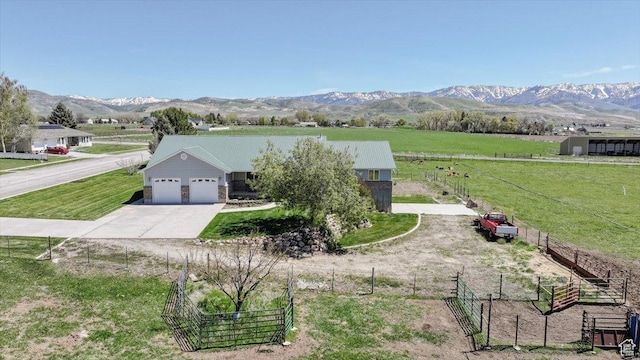 1176 E 900 S, Preston, ID 83263 - view of front of home featuring a garage, a view of countryside, driveway, and a mountain view