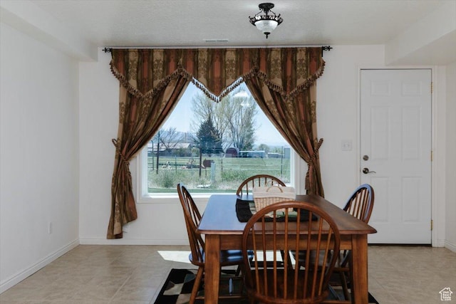 1176 E 900 S, Preston, ID 83263 - dining area featuring baseboards and light tile patterned floors