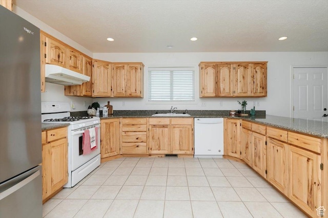 1176 E 900 S, Preston, ID 83263 - kitchen featuring white appliances, under cabinet range hood, recessed lighting, dark stone countertops, and light brown cabinetry