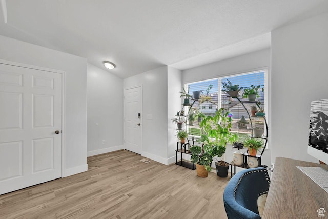 221 E Brookmeadow Dr, Harrisville, UT 84404 - foyer with light wood-style floors and baseboards