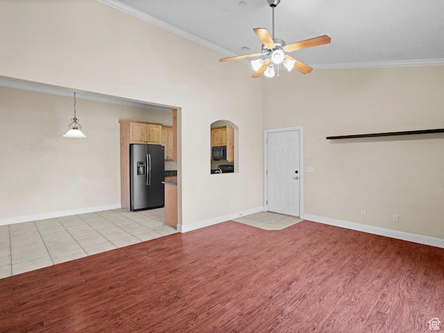 165 S Pleasant Grove Blvd Unit 45, Pleasant Grove, UT 84062 - unfurnished living room with light wood-style flooring, crown molding, baseboards, and ceiling fan