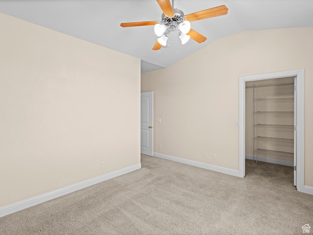 165 S Pleasant Grove Blvd Unit 45, Pleasant Grove, UT 84062 - unfurnished bedroom featuring baseboards, lofted ceiling, a spacious closet, and light colored carpet