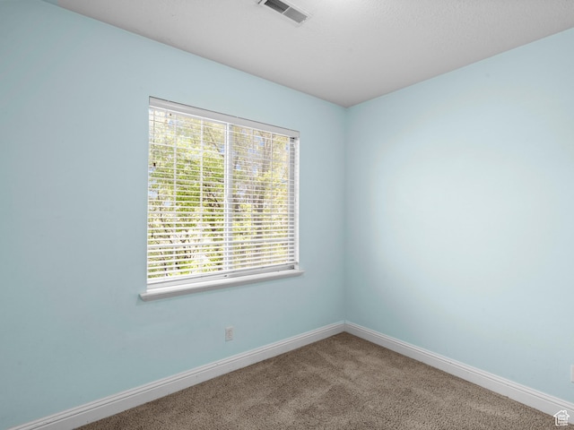 165 S Pleasant Grove Blvd Unit 45, Pleasant Grove, UT 84062 - carpeted empty room featuring baseboards, visible vents, and a healthy amount of sunlight