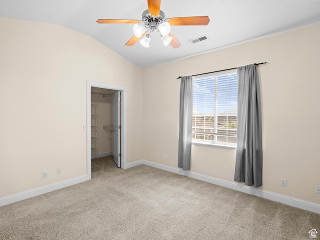 165 S Pleasant Grove Blvd Unit 45, Pleasant Grove, UT 84062 - unfurnished bedroom featuring baseboards, visible vents, carpet, a spacious closet, and lofted ceiling