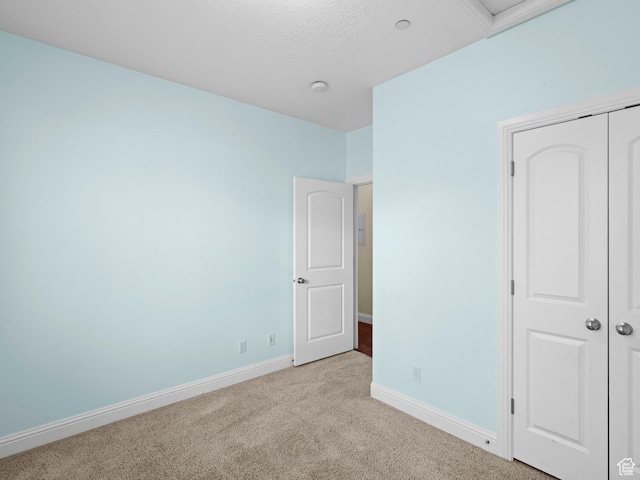 165 S Pleasant Grove Blvd Unit 45, Pleasant Grove, UT 84062 - unfurnished bedroom featuring a closet, carpet floors, a textured ceiling, and baseboards