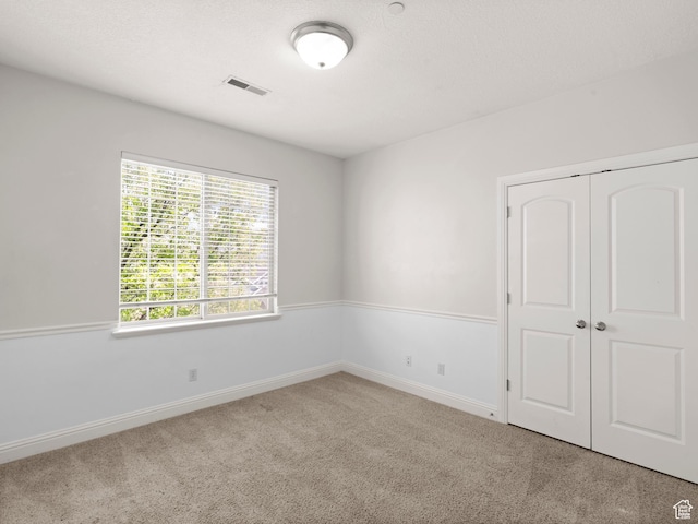 165 S Pleasant Grove Blvd Unit 45, Pleasant Grove, UT 84062 - unfurnished room with baseboards, visible vents, and carpet